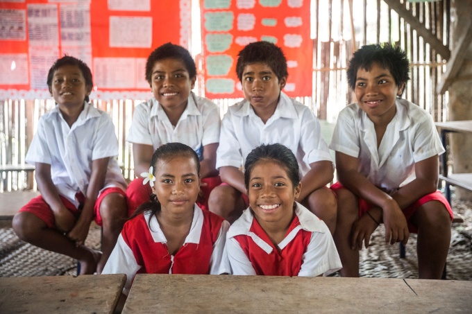 Grade 6 students of Mamatannana Primary School of  Abatao Island, South Tarawa, Kiribati, posing for a group photograph in a classroom. Credit: UNICEF/UN0202239/Sokhin